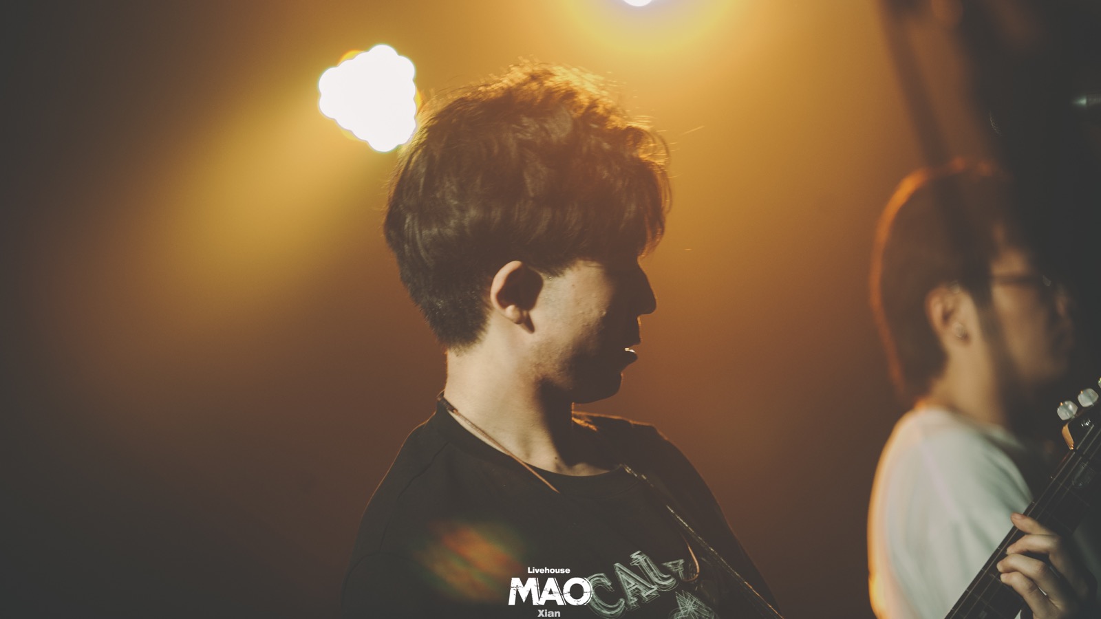 Older silhouette profile on stage