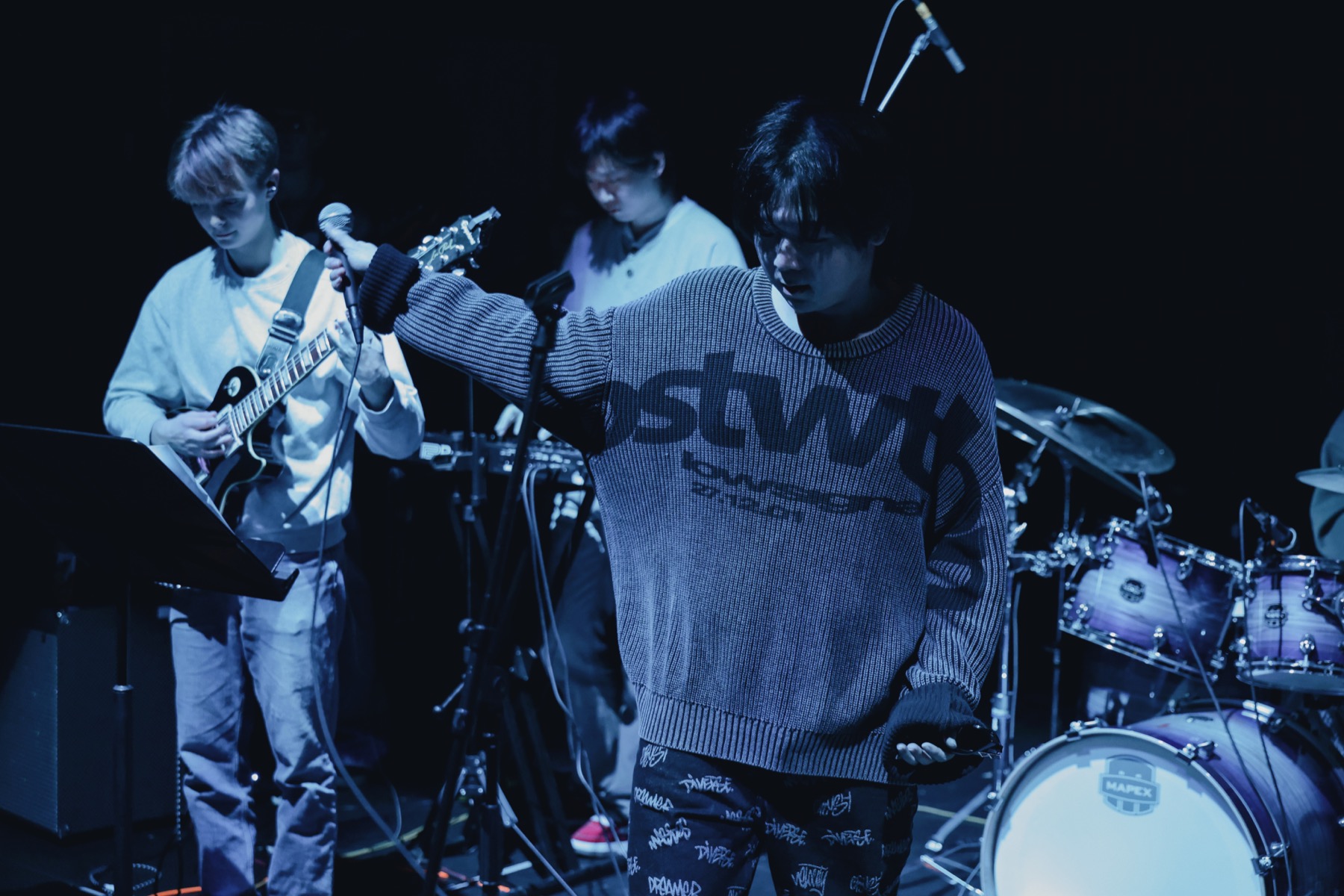 Recent WU and band under blue stage light
